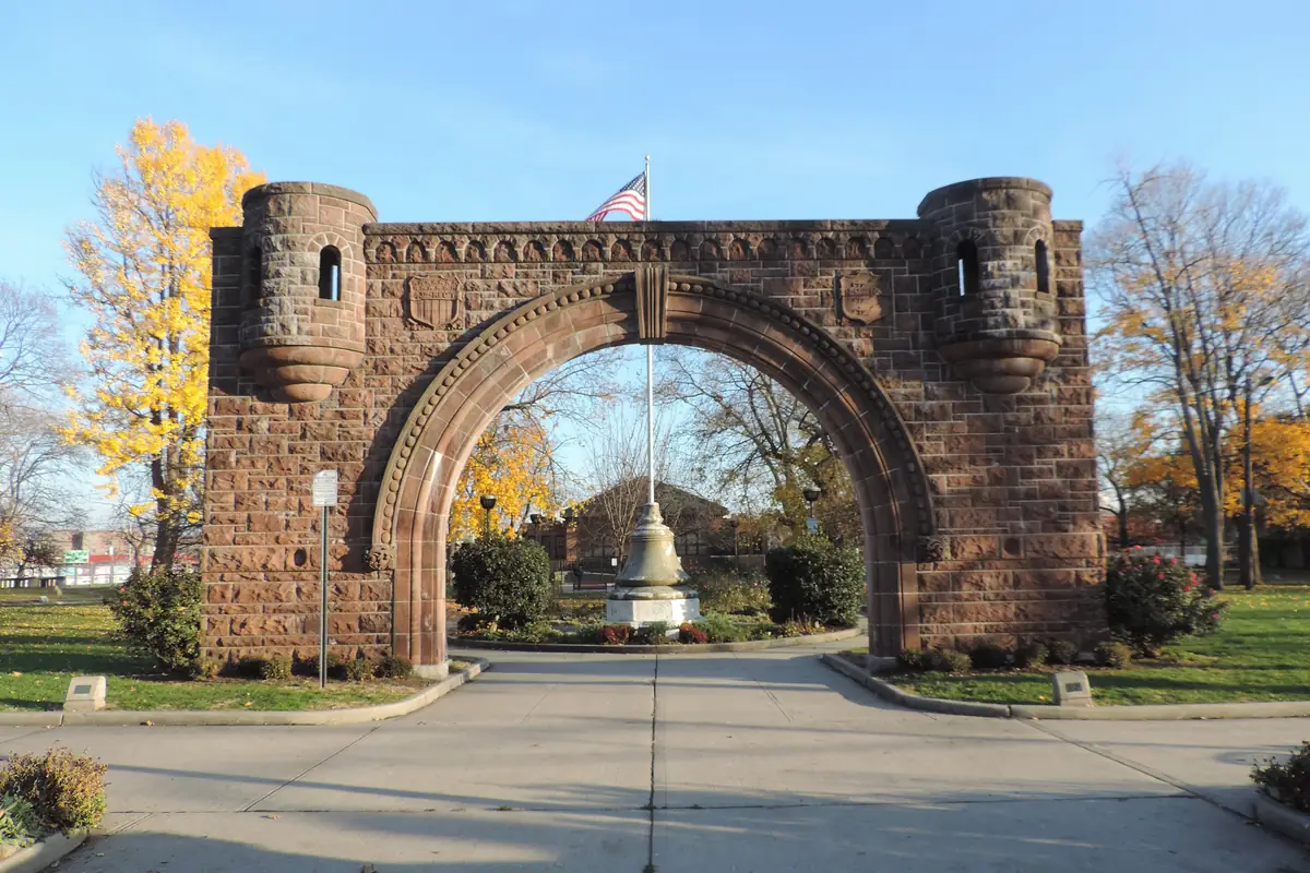 The Fourth Regiment Arch at the entrance to Pershing Field Park in Jersey City Heights on a sunny fall day