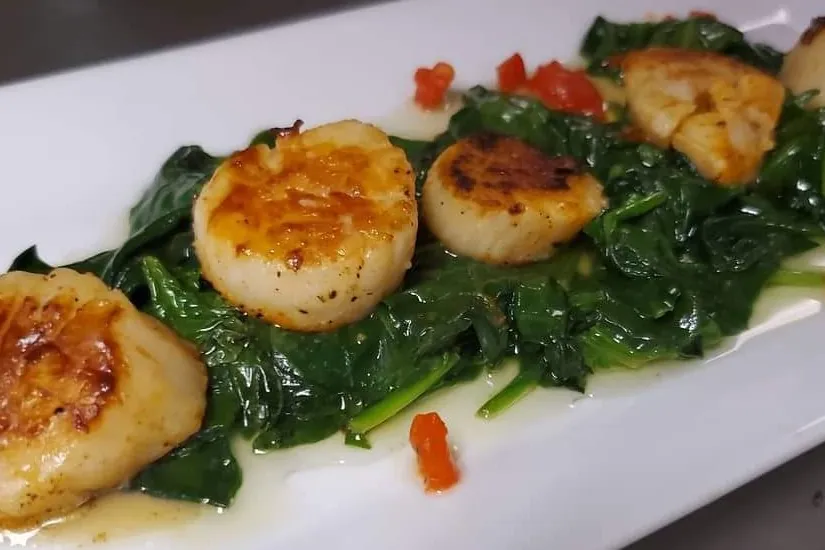 Seared scallops over spinach at Spanish Pavillion in Harrison, NJ