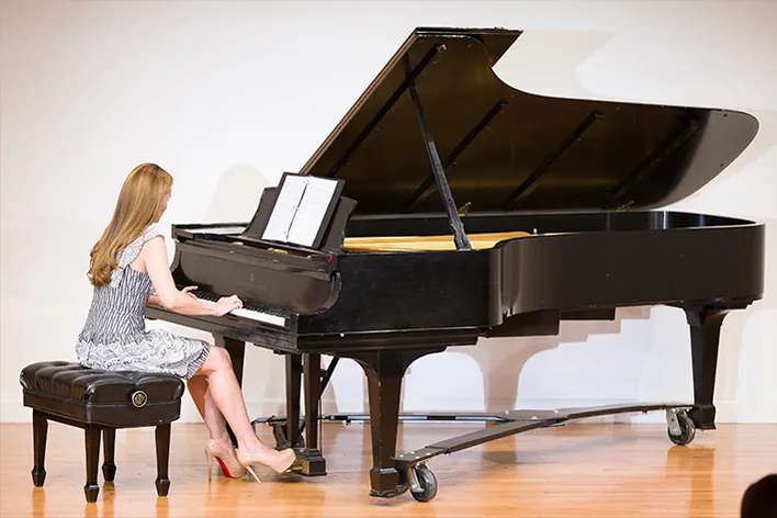 Pianist at a grand piano for Theater Steps music lessons in West New York, NJ