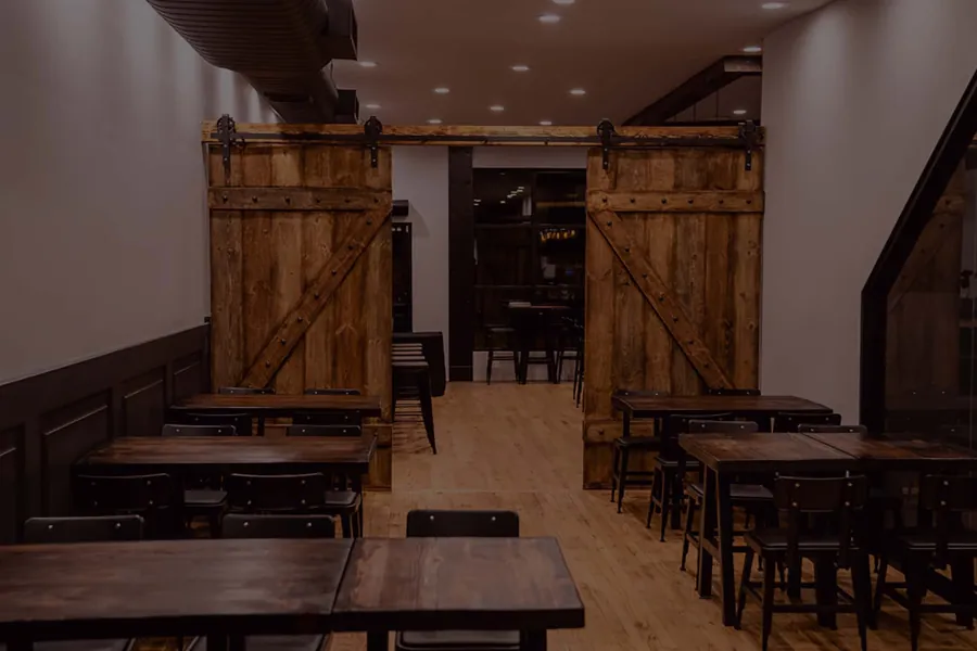 Urban Tandoor dining room with wood tables in Harrison, NJ